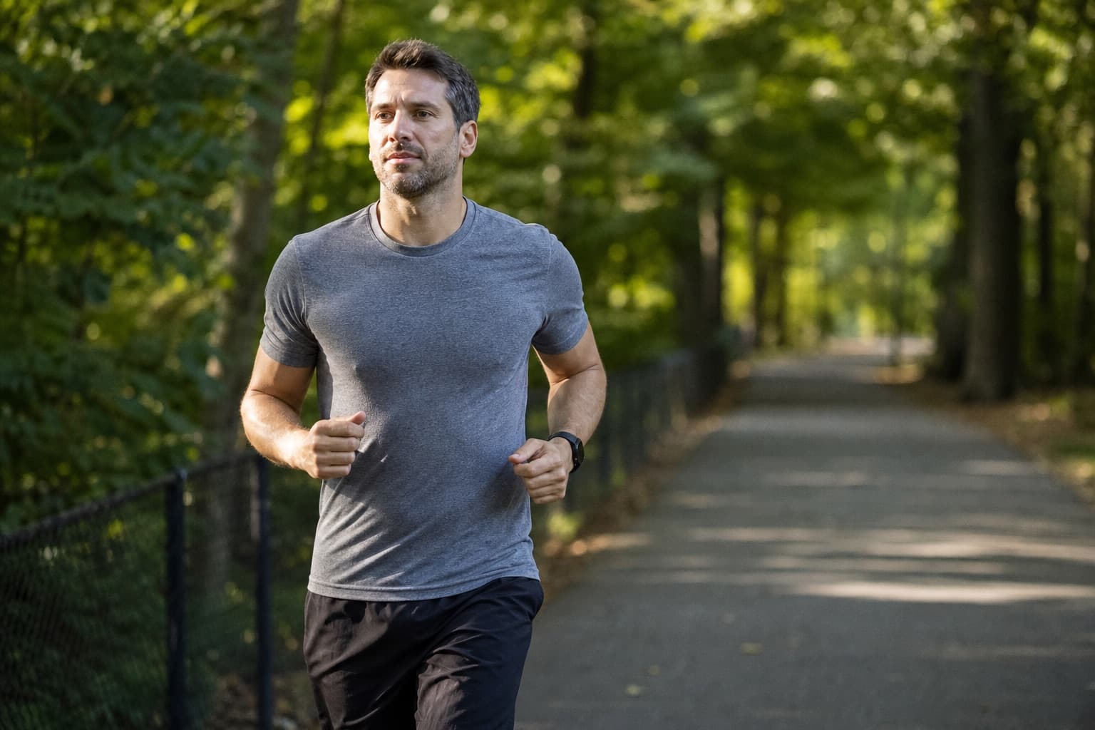 Returning runner rebuilding endurance on a quiet tree-lined path.