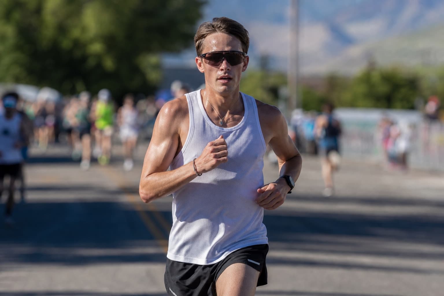 Runner holding steady controlled discomfort through the middle of a 10K.