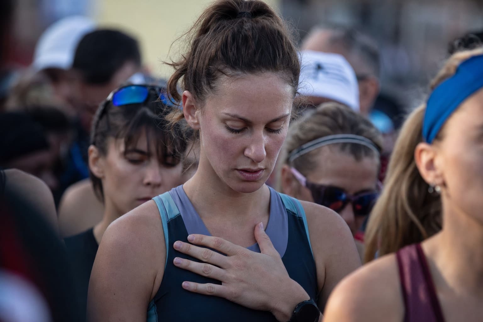 Runner breathing and staying calm in a crowded start corral before a race.