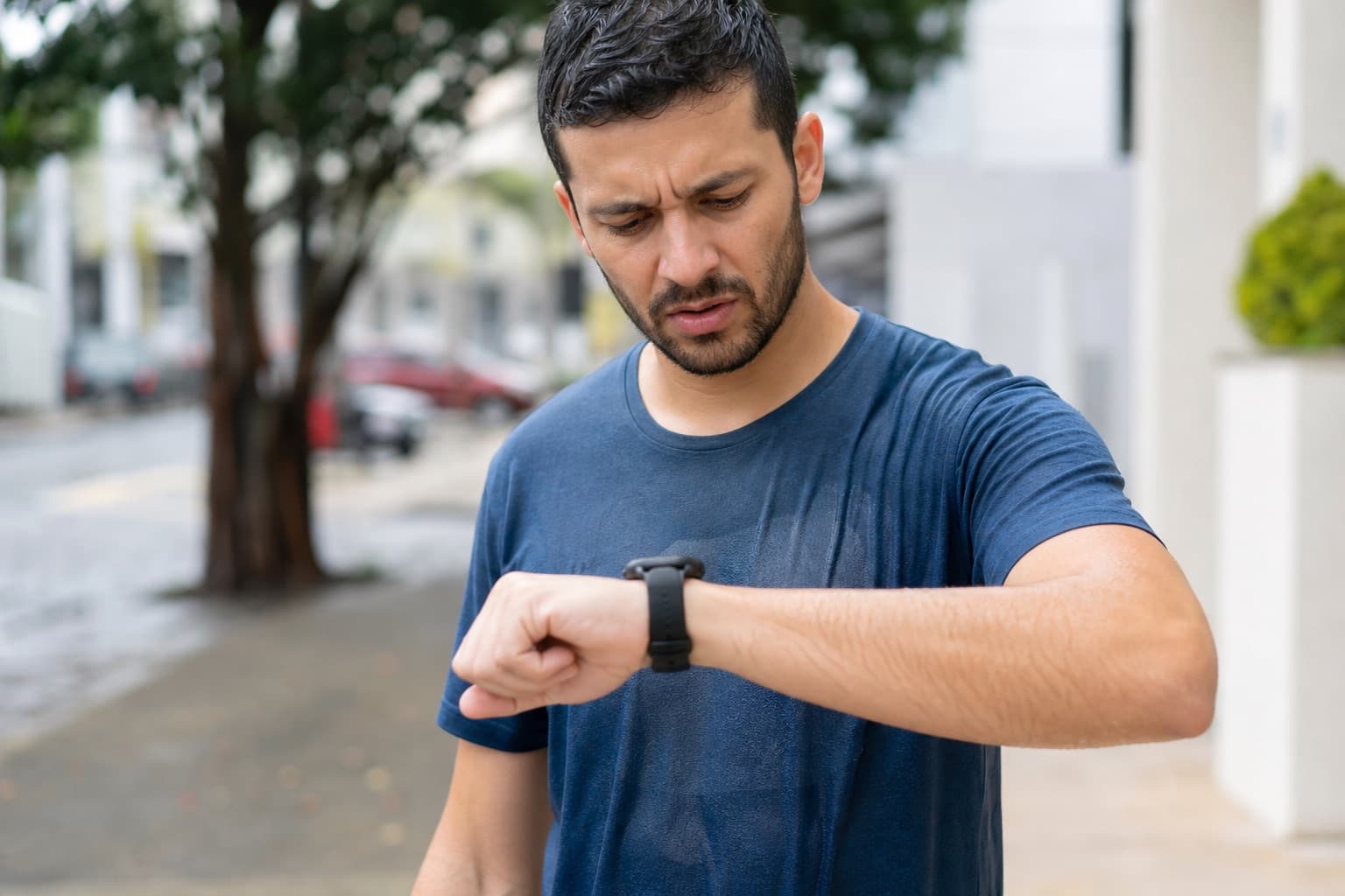 Runner looking puzzled at a race prediction on a GPS watch after a run.