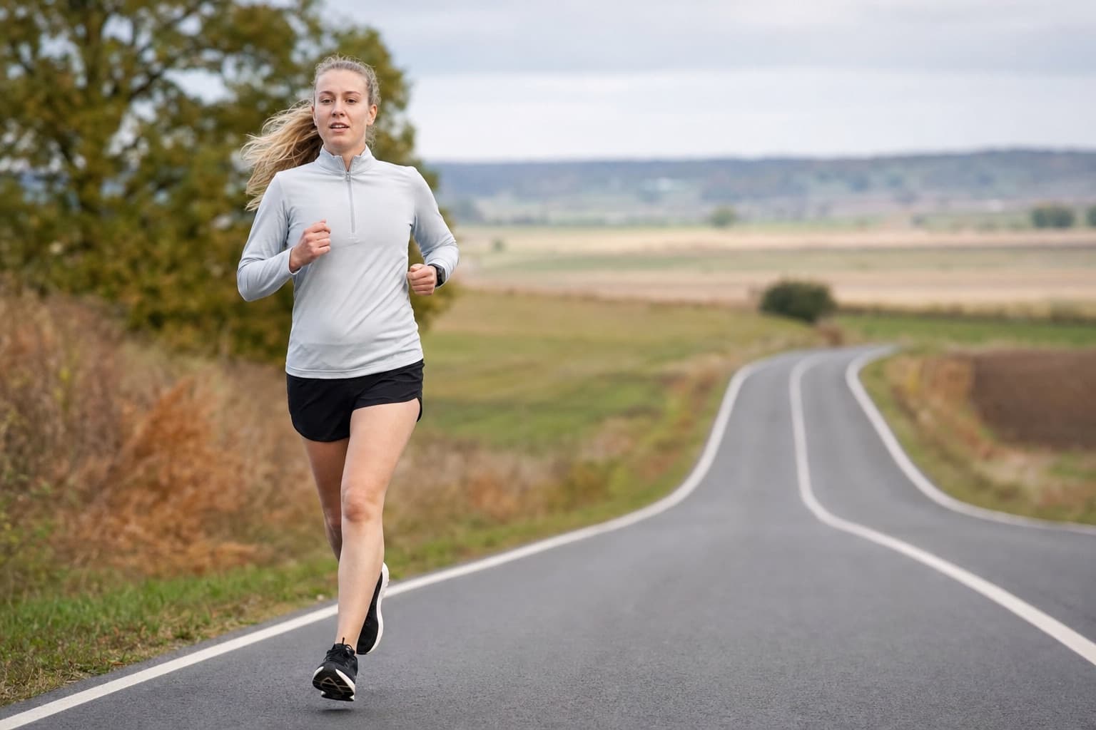 Runner building weekly volume on a gently rolling country road.