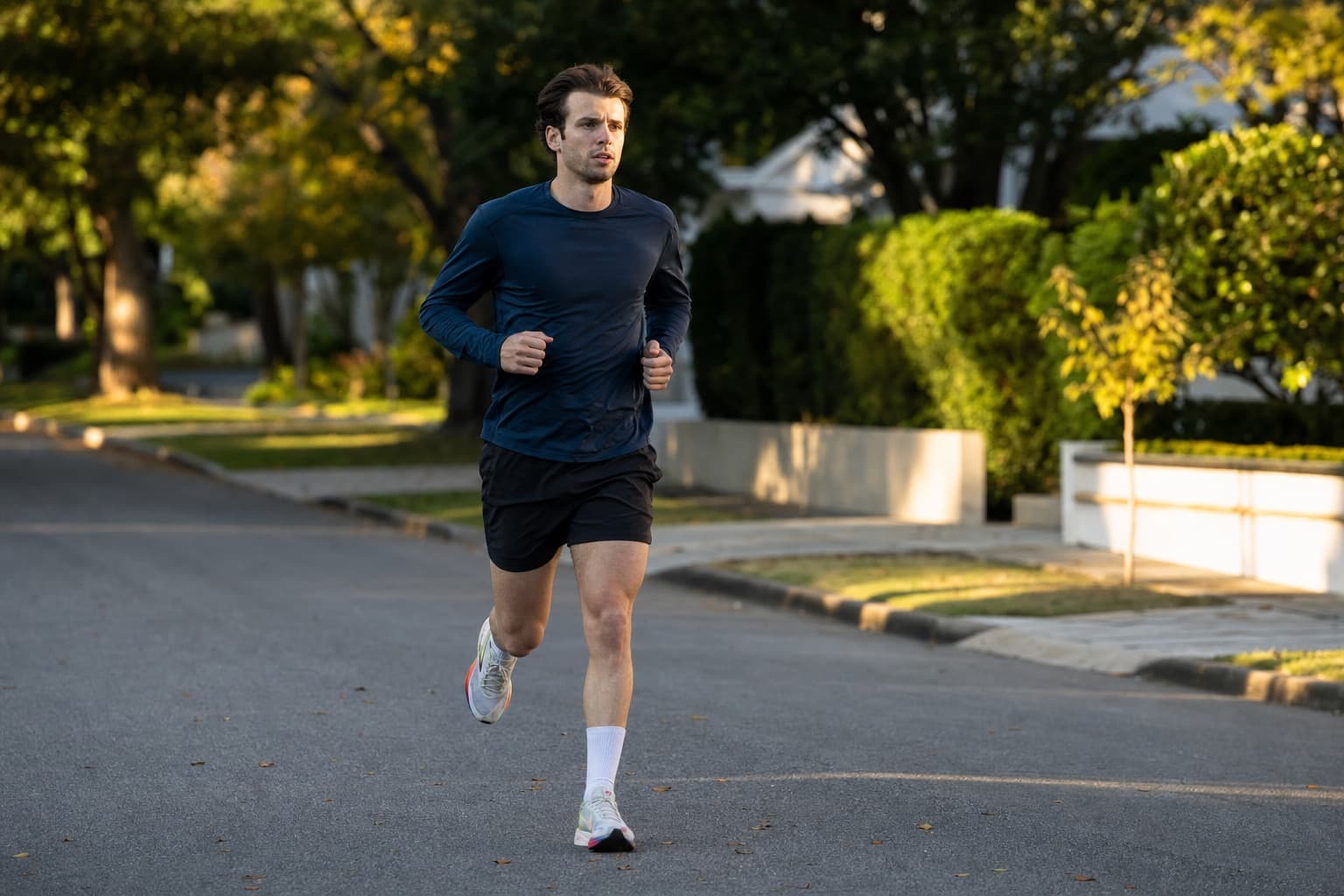 Runner jogging an easy shakeout run on a quiet street before race day.