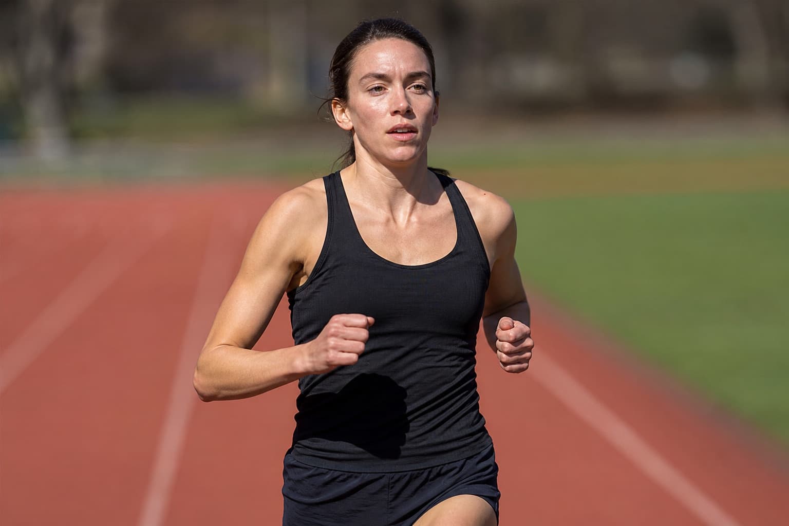 Runner keeping a short, controlled fast effort during a cutback week.