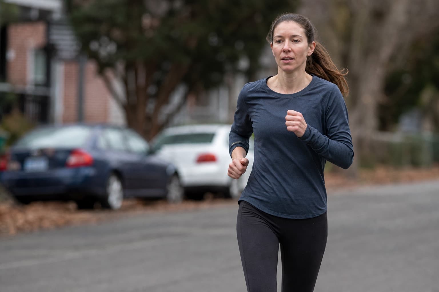 Returning runner easing back into training on a quiet residential street.