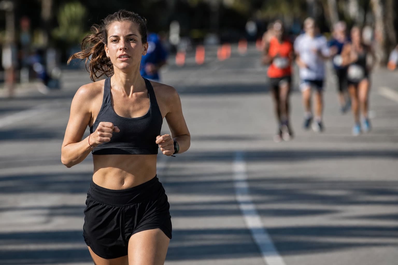 Runner settled into a relaxed rhythm partway through a road marathon.