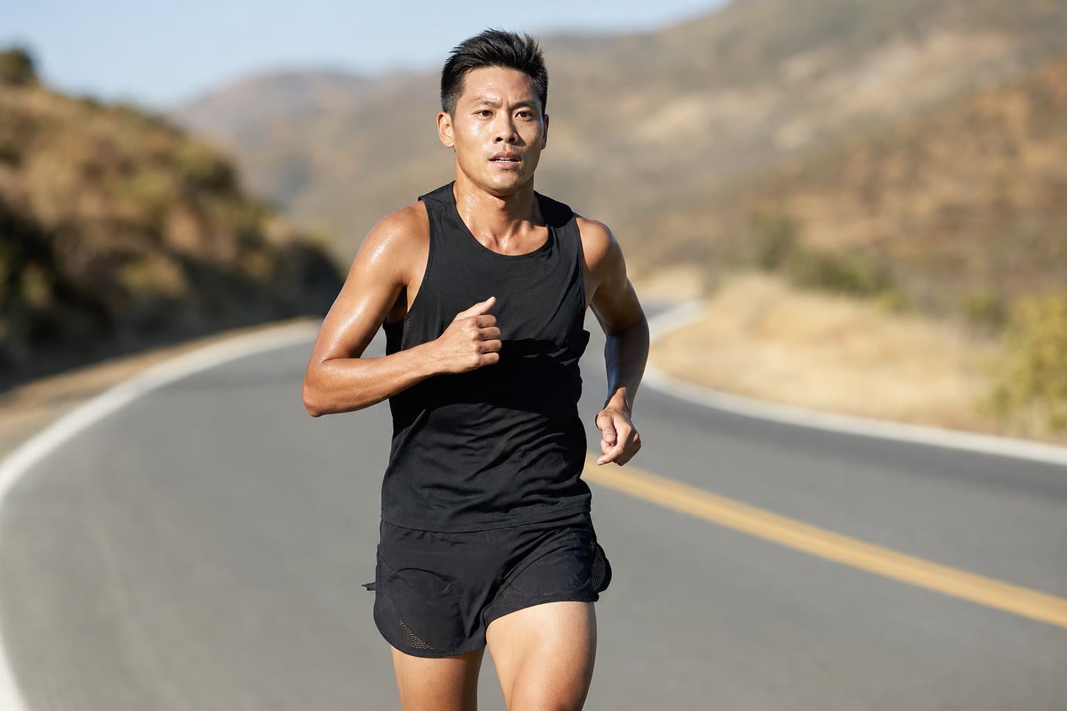 Runner holding a hard, steady tempo effort with focused concentration.