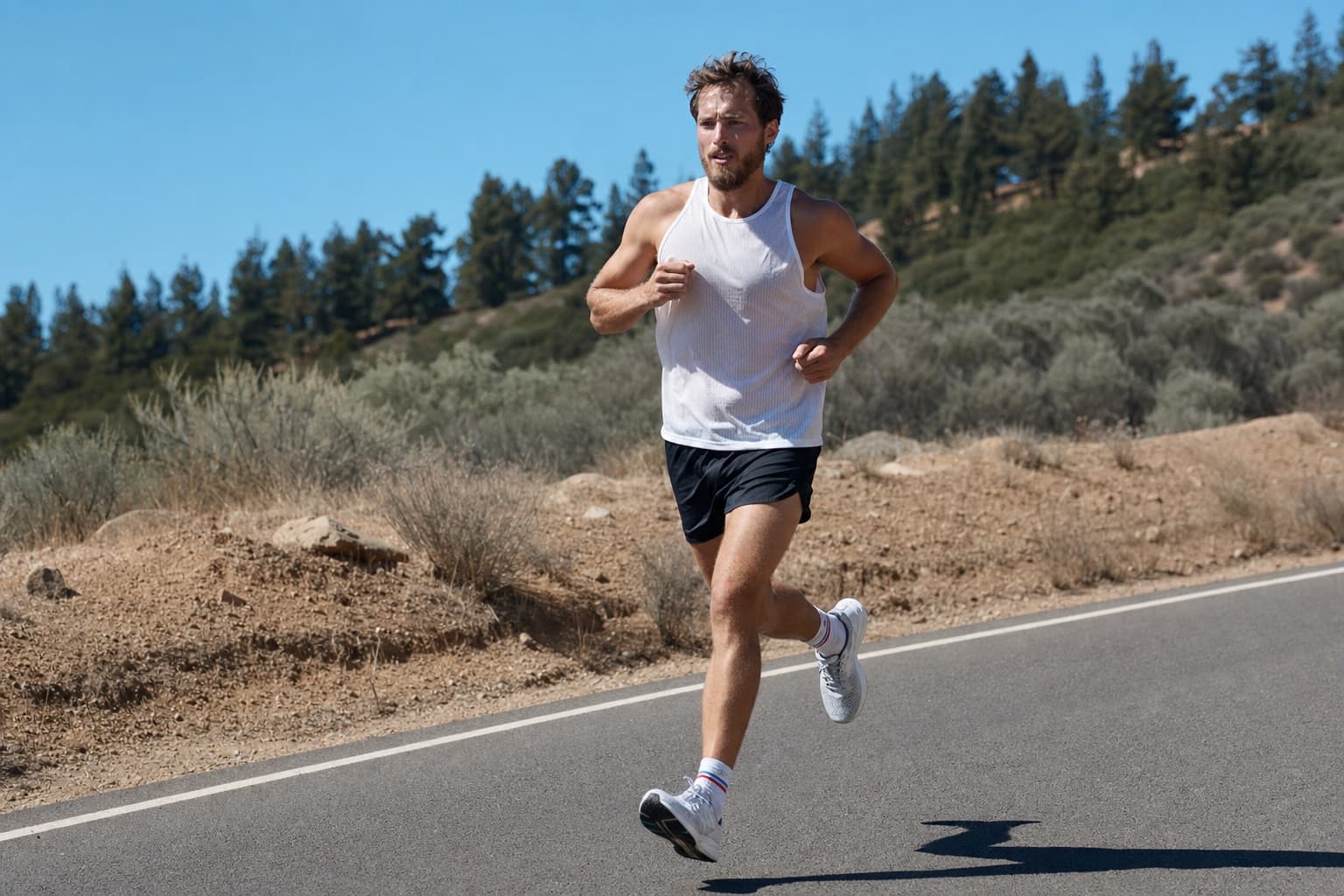 Runner picking up to a focused marathon-pace segment late in a long run.