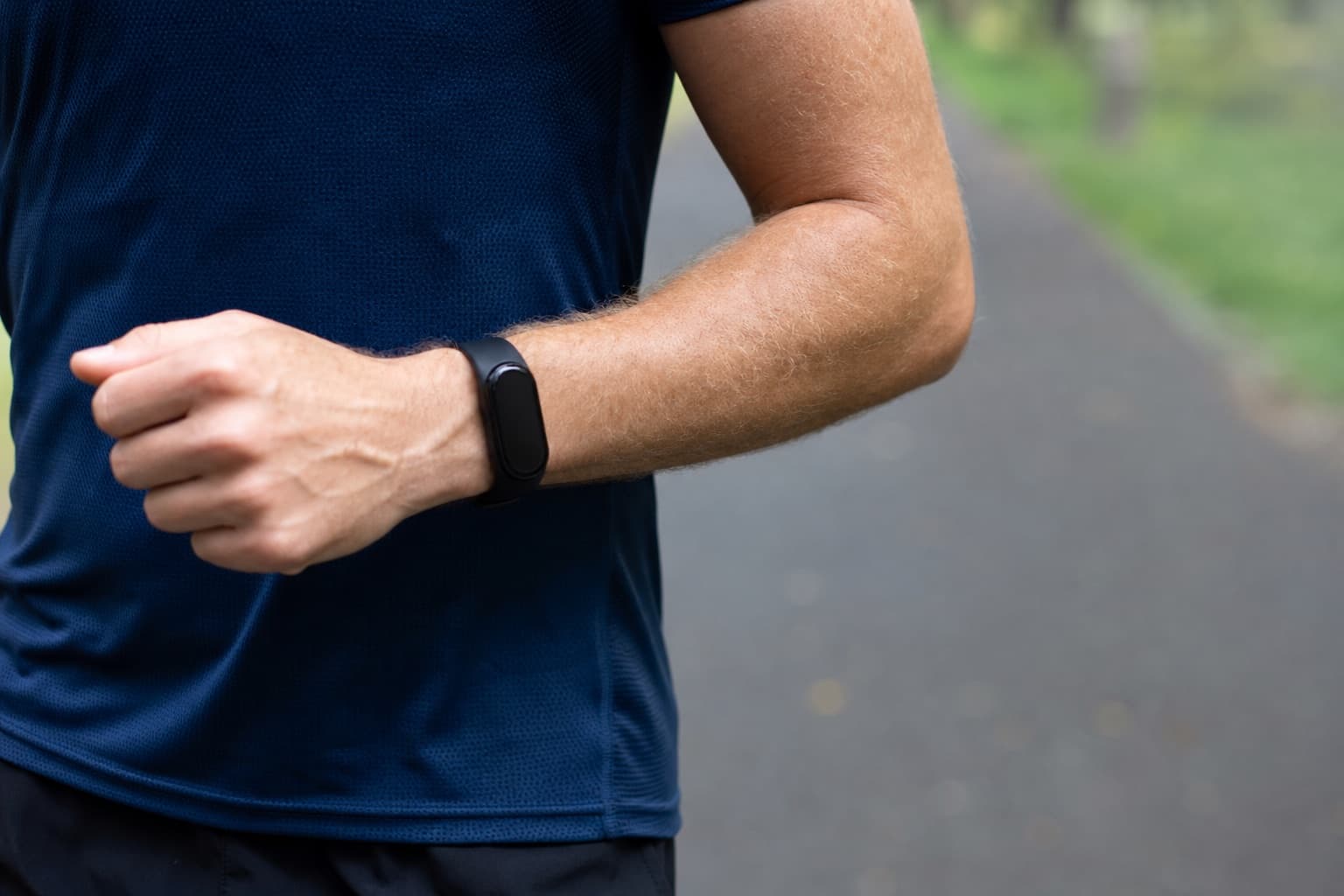 Close-up of a wrist heart rate monitor worn by a runner during an easy run.